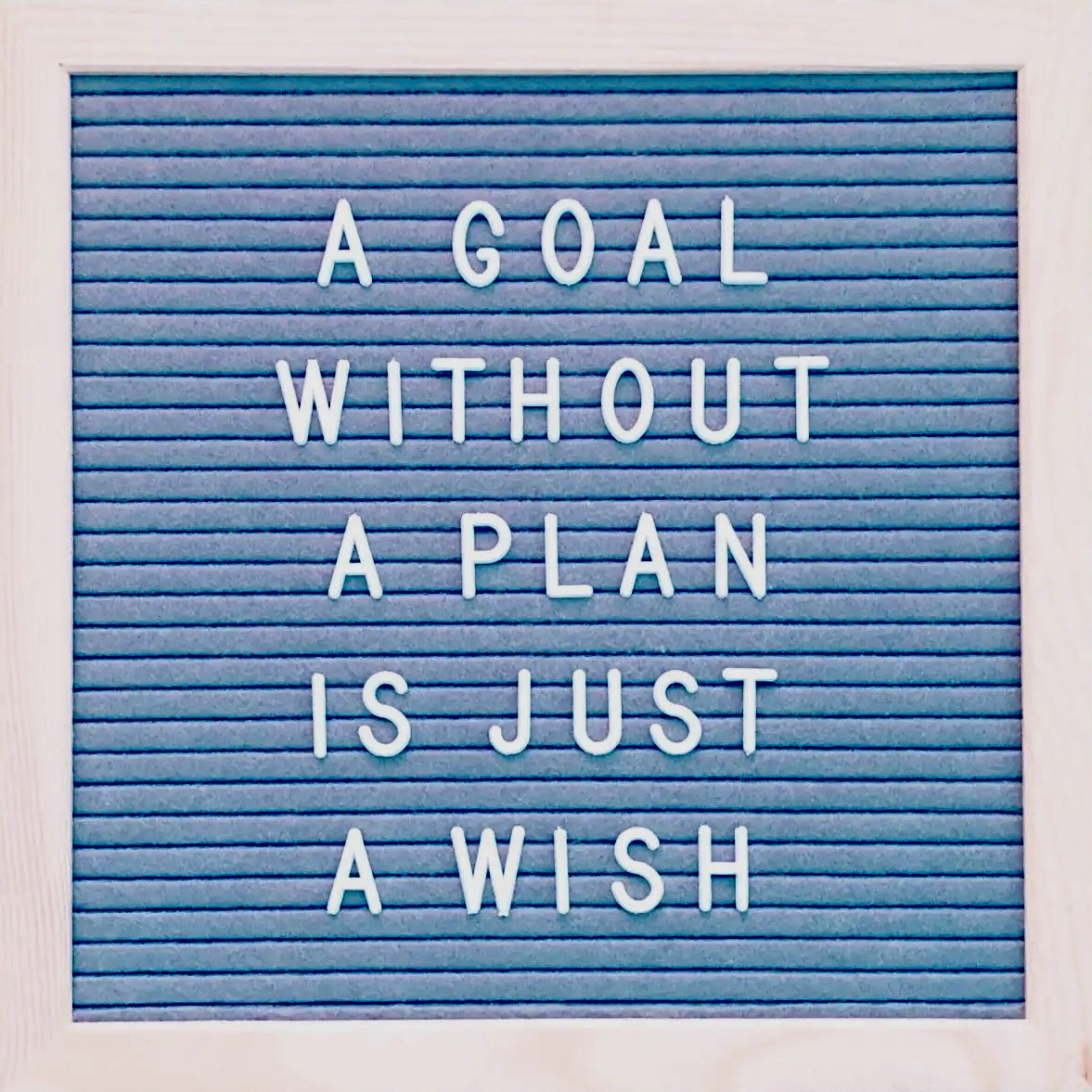 A blue letter board with the words " goal without plan is just wish ".